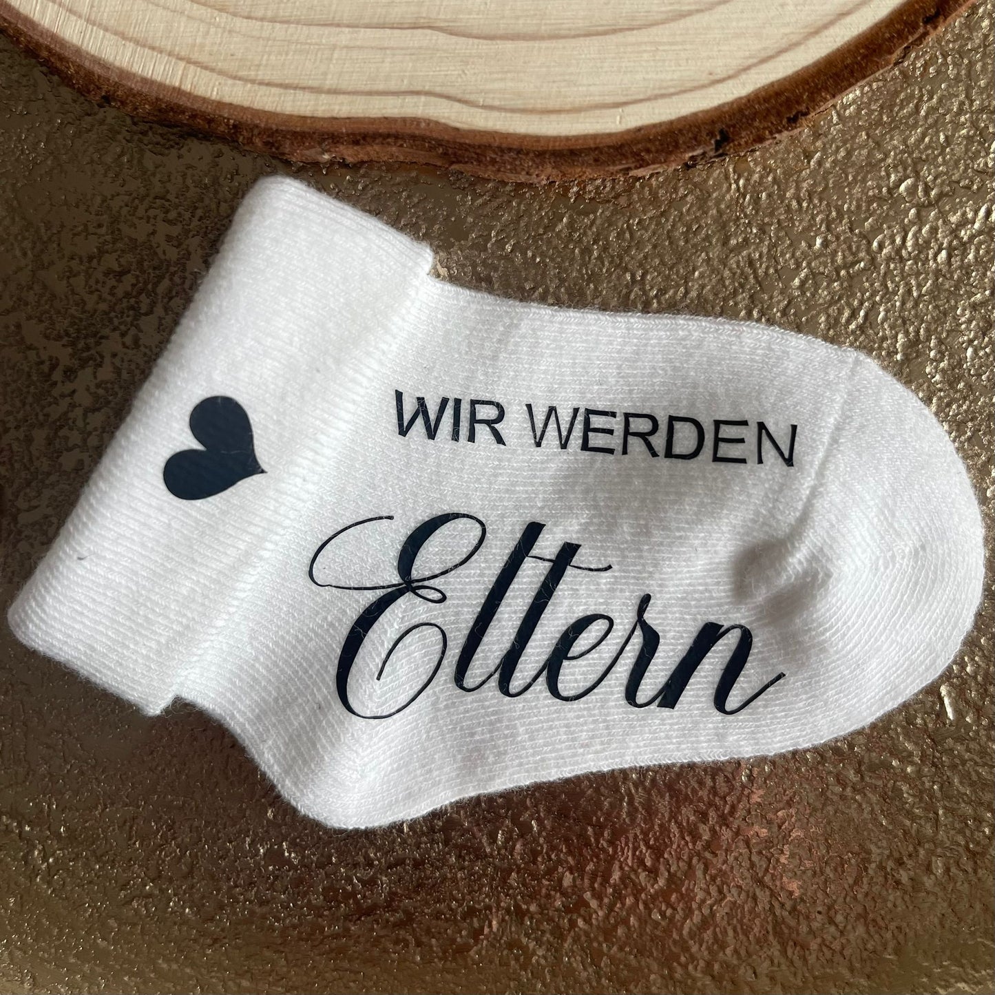 Babysocke zur Schwangerschaftsverkündung