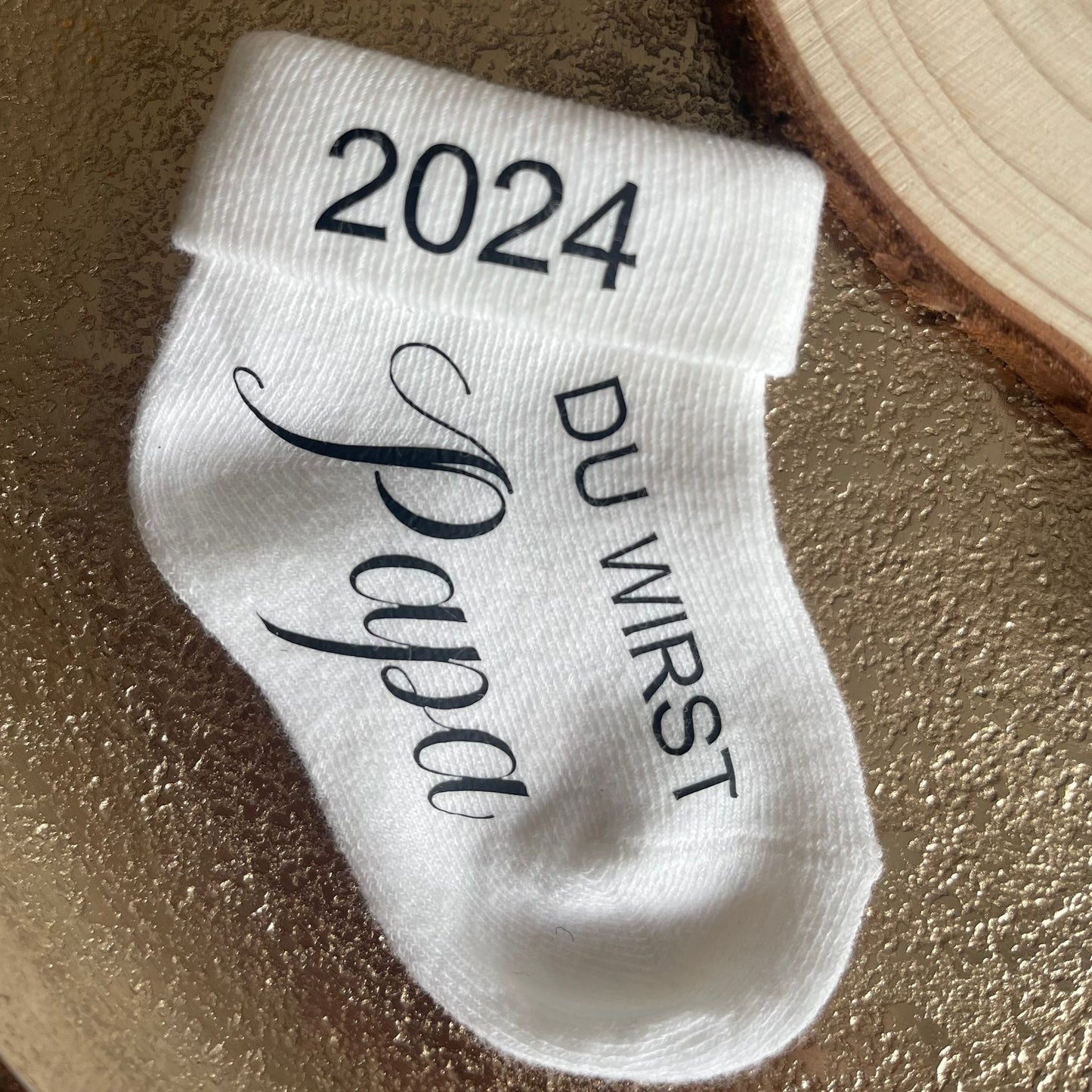 Babysocke zur Schwangerschaftsverkündung
